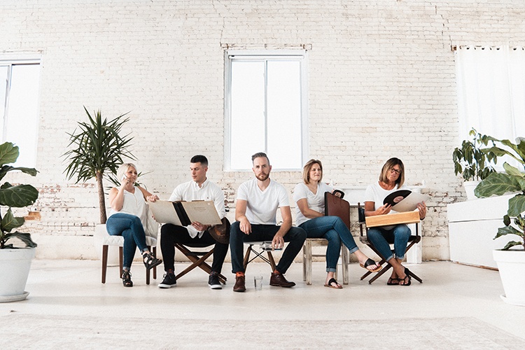 A Group of Team Posing for Branding With a Classy White Theme - Corporate Headshots by Headshot Photographer in Minneapolis