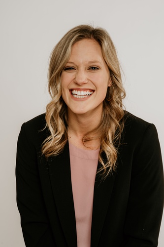 Woman Posing in a Black Suit with a Smiling Face - Professional Headshots by Headshot Photographer in Minneapolis 