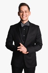 Man Posing in a Black Suit and Black Bow - Linked - In Headshots by Headshot Photographer in Minneapolis