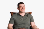 Portrait of a Man Sitting on a Chair with a Smiling Face - Commercial Headshots by Headshot Photographer in Minneapolis 